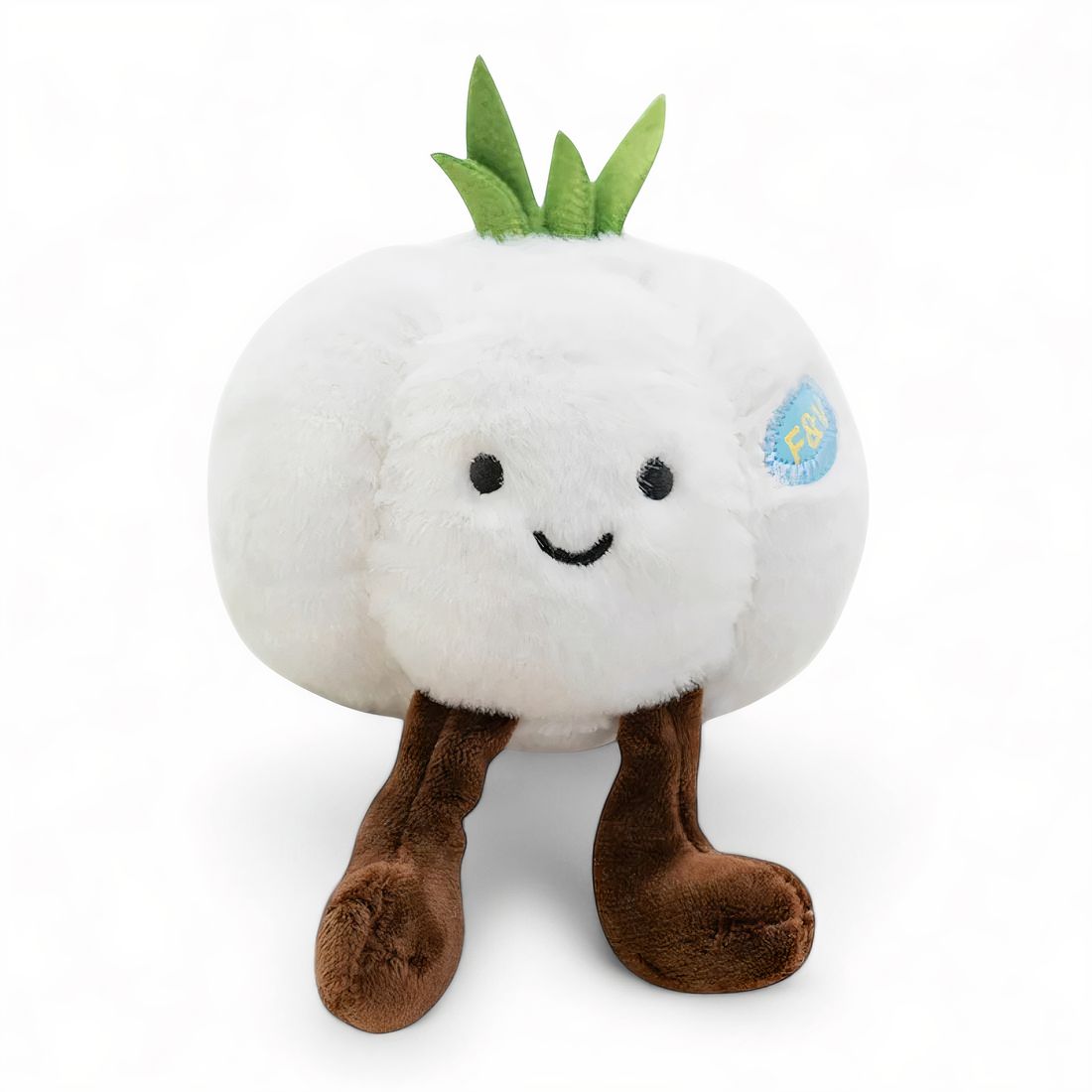 Peluche kawaii représentant une tête d’ail blanche, avec des pousses vertes et des jambes marron, sur fond blanc.
