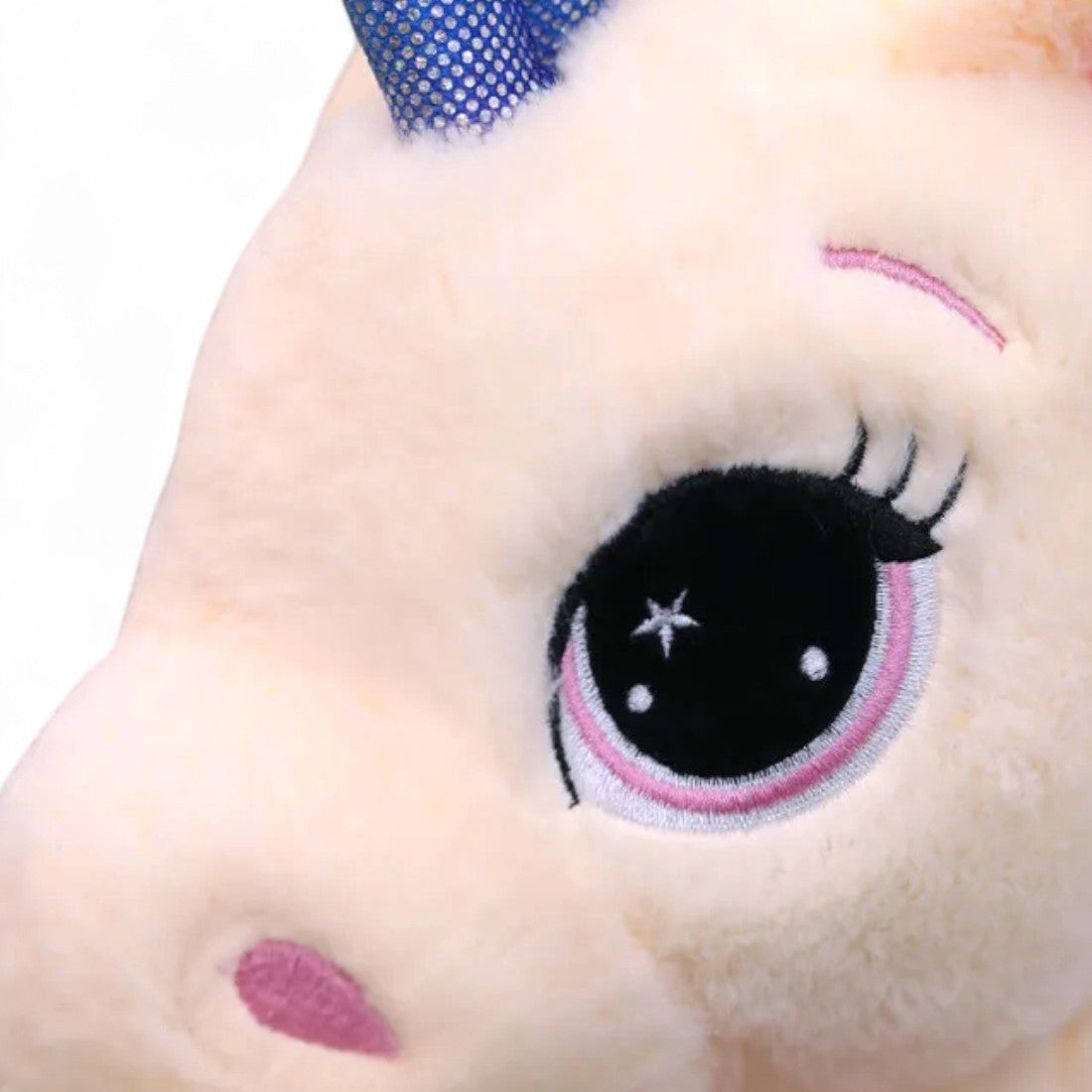 Peluche licorne arc-en-ciel allongée