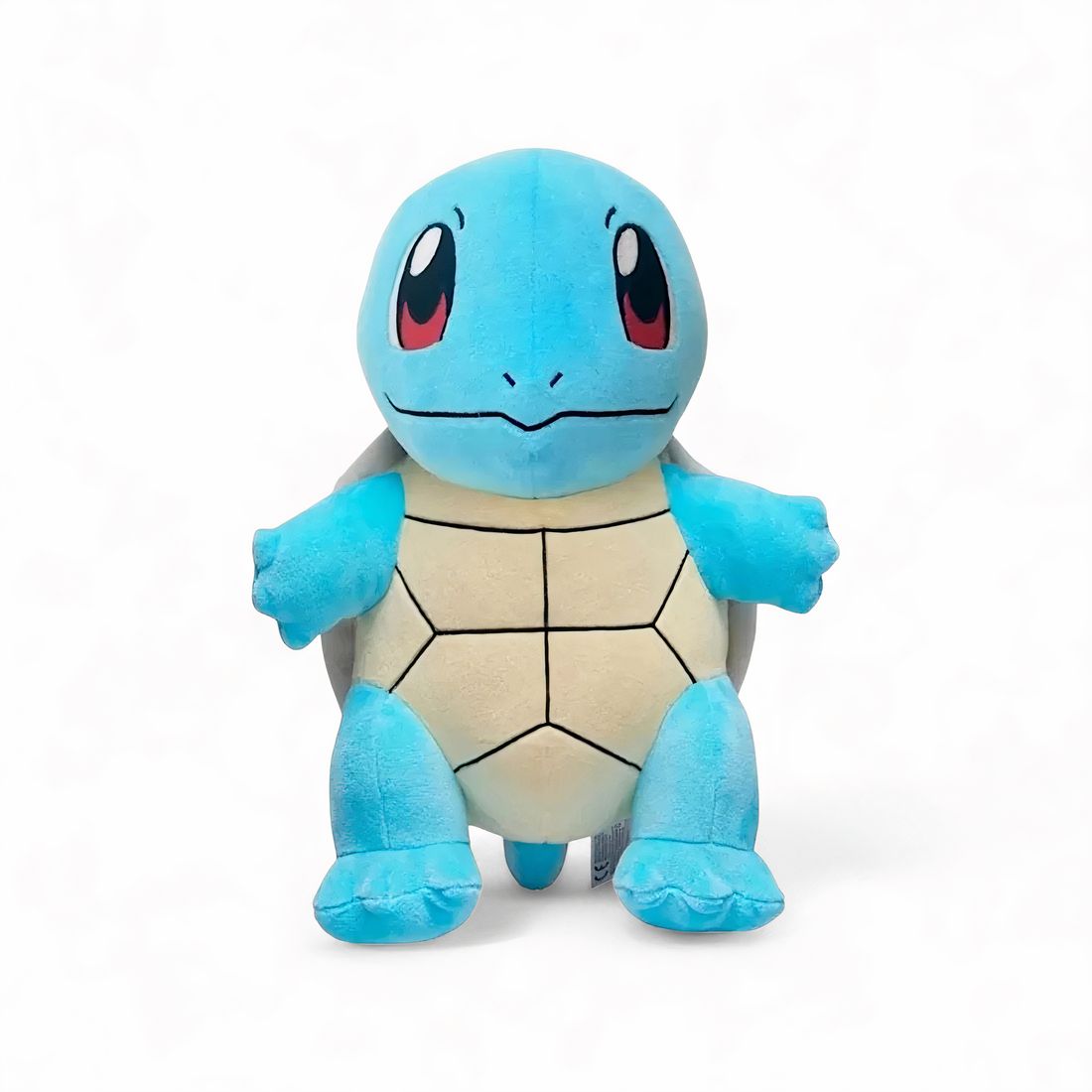 Peluche Carapuce Pokémon bleue représentant une tortue, debout, sur fond blanc.