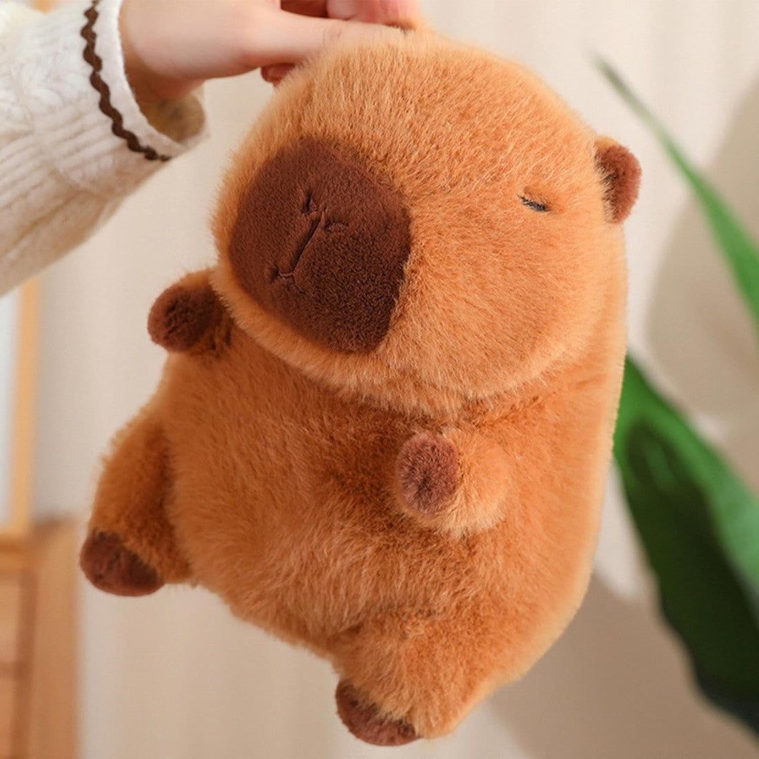 Peluche Capybara avec chapeau et sac légume