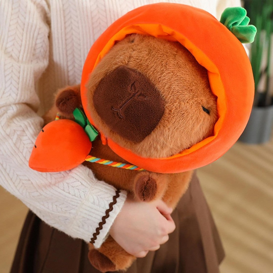 Peluche Capybara avec chapeau et sac légume