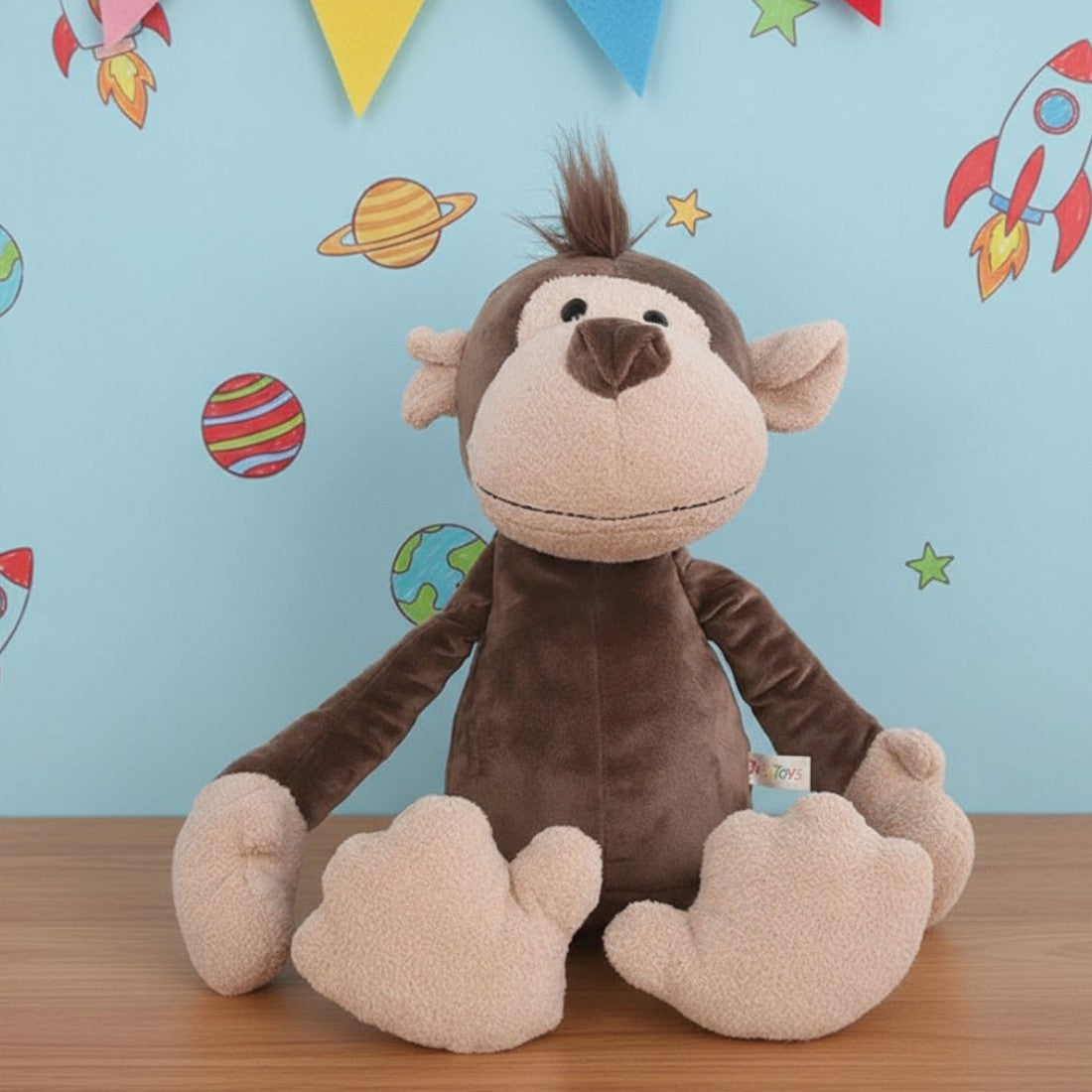 Peluche singe malicieux
