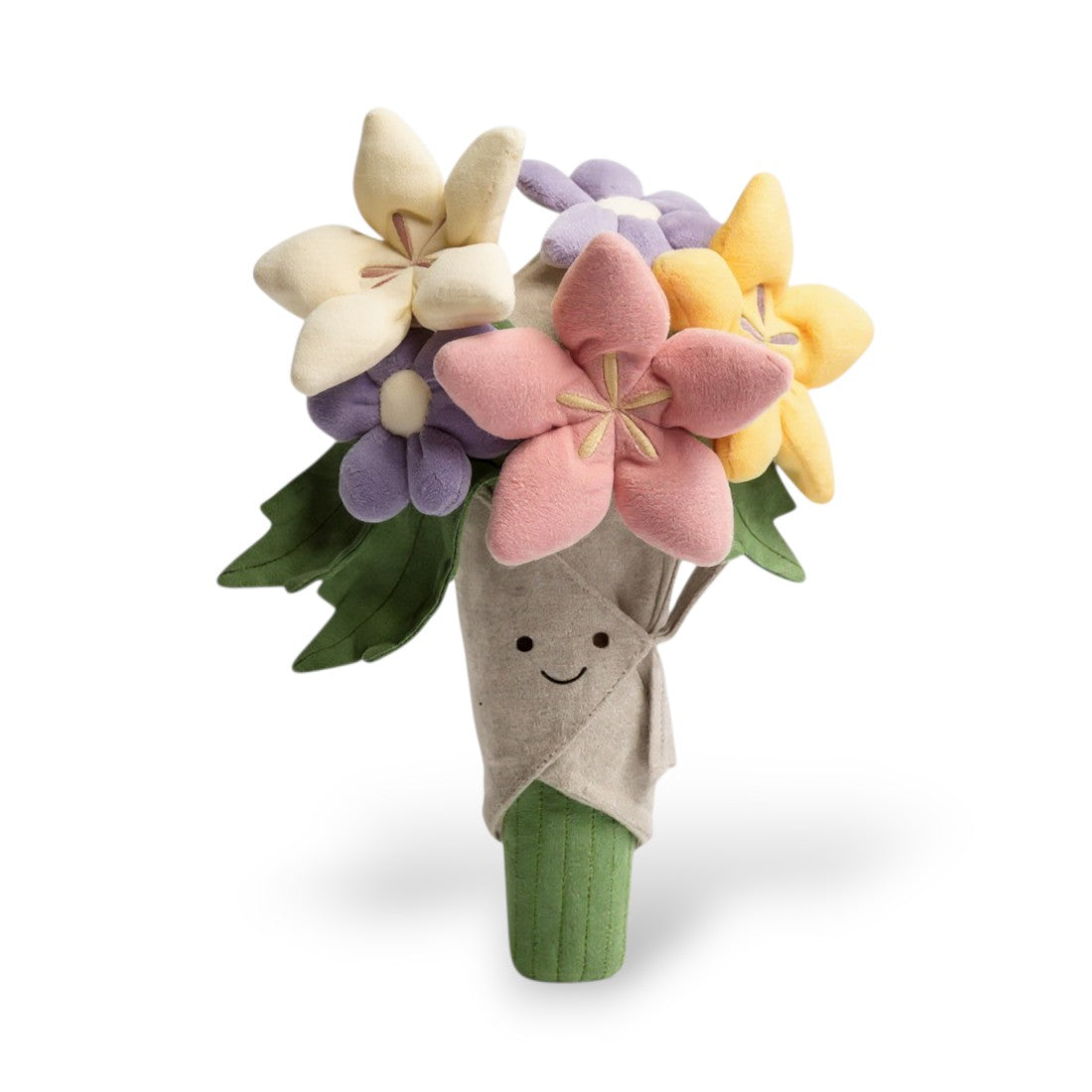Une peluche représentant un bouquet de fleurs multicolores (jaune, rose, violet, blanc, beige) dans un cornet papier beige avec visage souriant aux grands yeux, feuilles vertes et base verte, sur fond blanc.