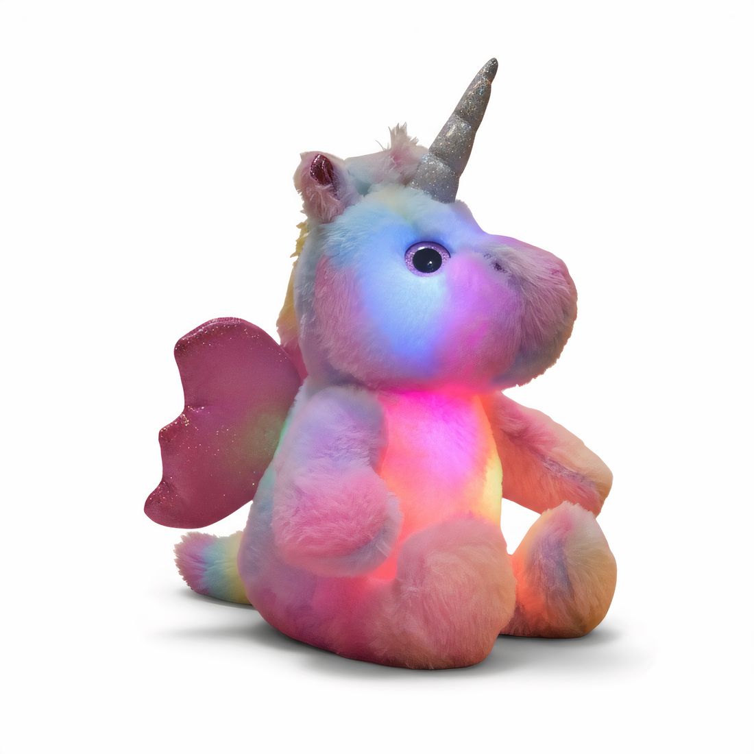 Licorne en peluche coloré avec corne argentée et ailes scintillantes, illuminée de l'intérieur, posée sur fond blanc.
