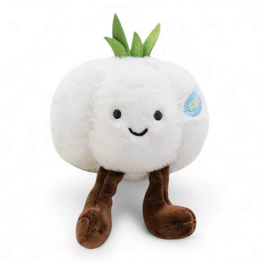 Peluche kawaii représentant une tête d’ail blanche, avec des pousses vertes et des jambes marron, sur fond blanc.