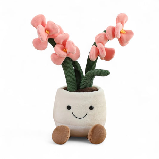 Peluche plante orchidée rose dans un pot en tissu beige souriant, sur fond blanc.