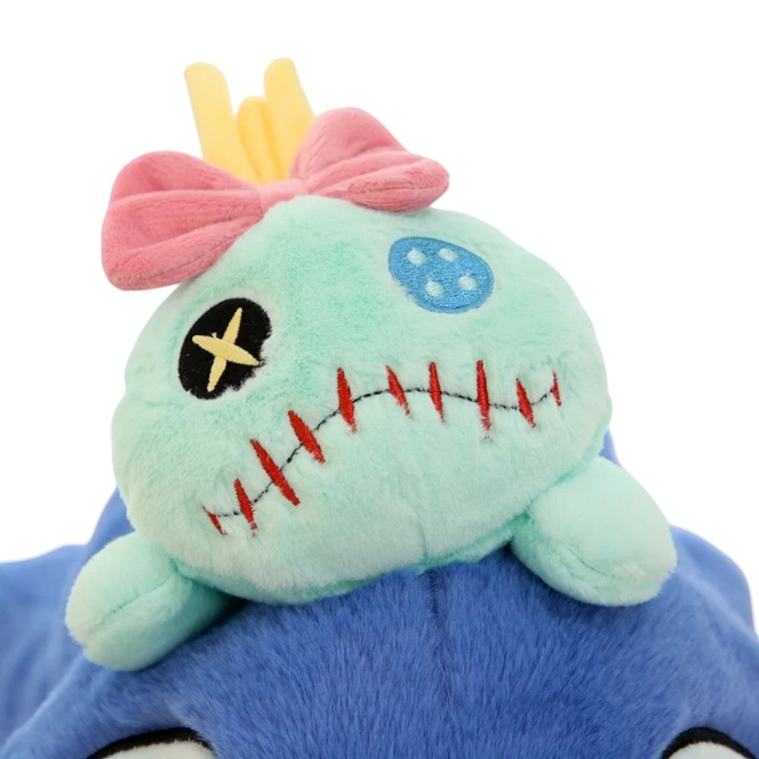 Peluche Stitch allongé avec le doudou de Lilo