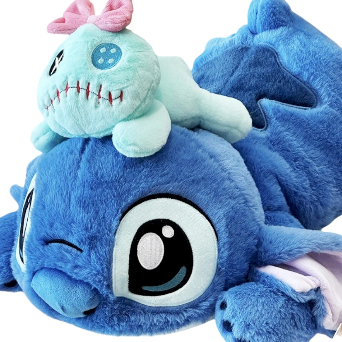 Peluche Stitch allongé avec le doudou de Lilo