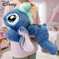 Peluche Stitch allongé avec doudou de Lilo