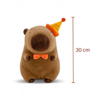 Peluche capybara avec chapeau de fête