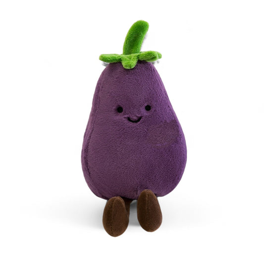 Peluche aubergine kawaii violette avec feuilles vertes et petites jambes marron, souriante, sur fond blanc.