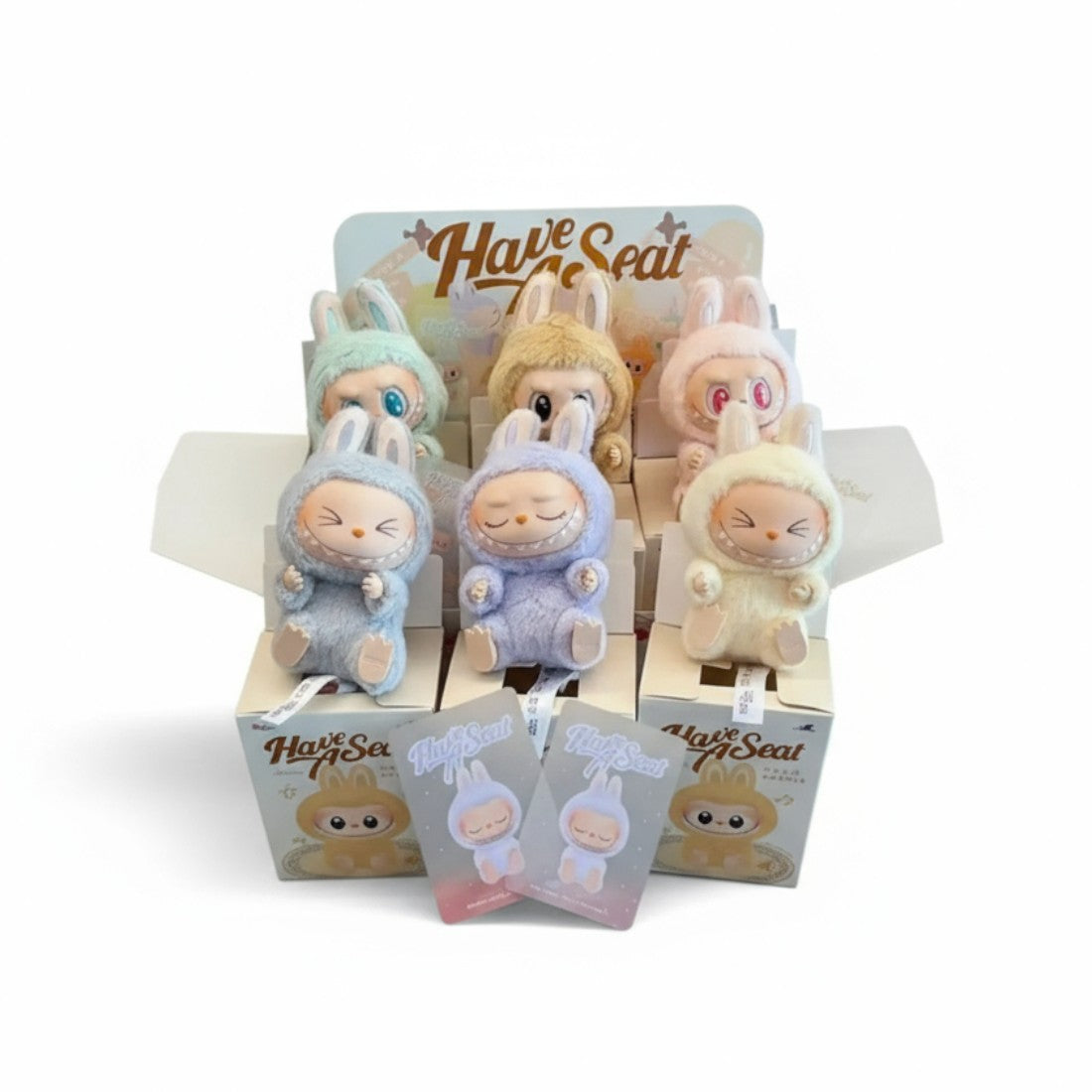 Blind box peluche type Labubu assis (non officiel)