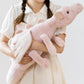 Dragon en peluche aux couleurs pastel