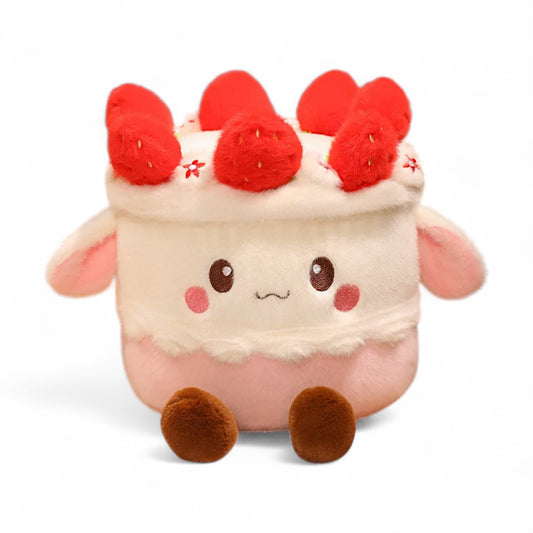 Peluche kawaii en forme de gâteau gourmand rose et blanc, avec des framboises sur la tête, des petites oreilles et des pieds marron, et deux yeux et une bouche brodés style kawaii ; sur fond blanc.