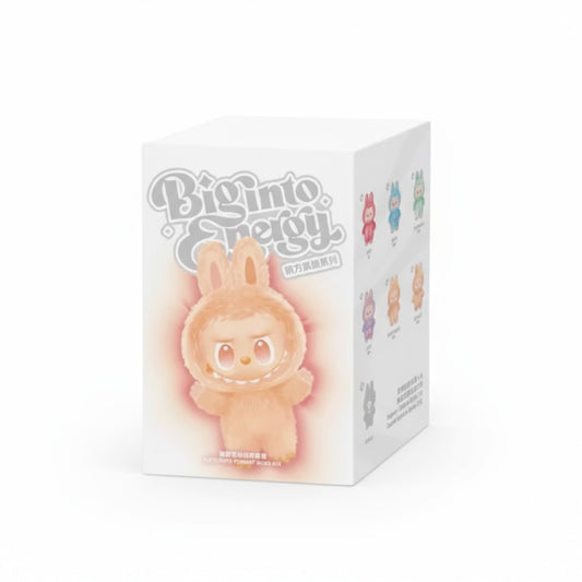 Boite en carton blanc, avec un dessin d'un monstre labubu jaune dessus, sur fond blanc.