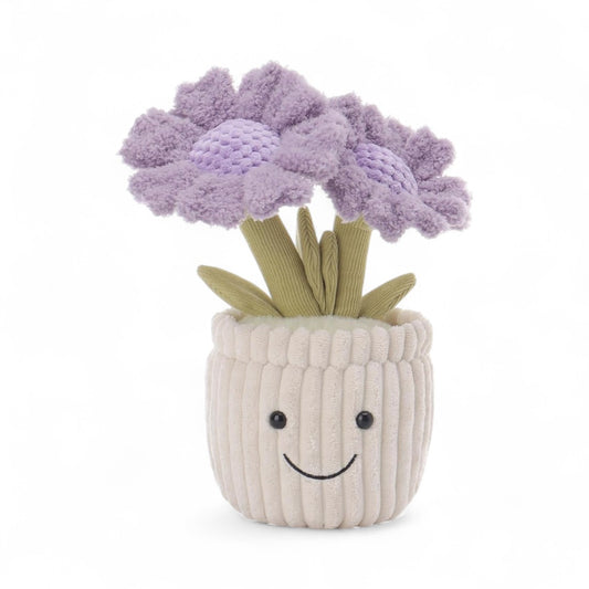 peluche plante pot de fleurs violettes avec sourire, sur un fond blanc