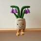 Peluche plante kawaii pot fleurs violettes