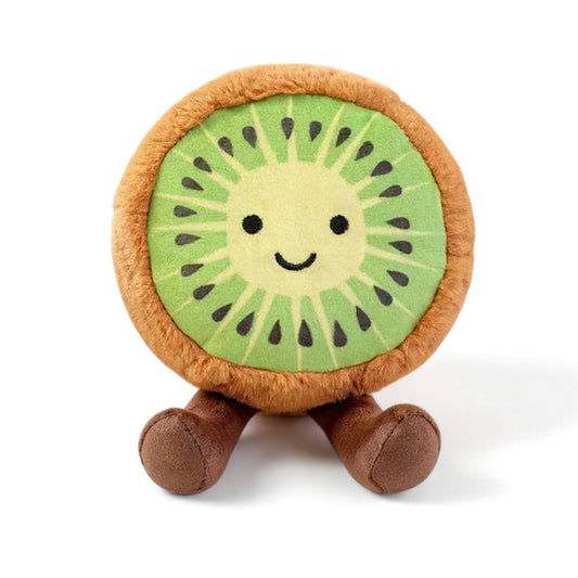 Peluche ronde en forme de kiwi vert avec un visage souriant et des pattes marron, posée sur fond blanc.