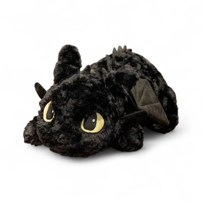 Peluche noire Krokmou de la saga Dragons DreamWorks, toute douce, sur fond blanc.