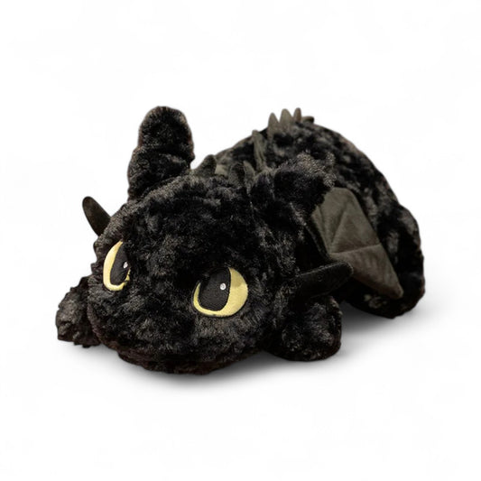 Peluche noire Krokmou de la saga Dragons DreamWorks, toute douce, sur fond blanc.
