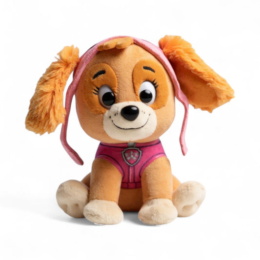 Peluche Stella avec pelage beige, oreilles duveteuses, tenue rose et lunettes roses sur la tête, souriante, posée assise sur fond blanc.