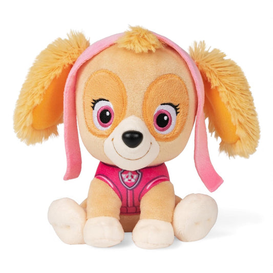 Peluche Stella avec pelage beige, oreilles duveteuses, tenue rose et lunettes roses sur la tête, souriante, posée assise sur fond blanc.