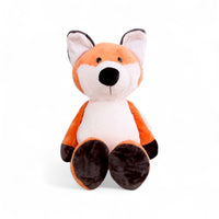Peluche renard orange et blanc, oreilles dressées, pattes foncées, sourire doux, assise sur fond blanc.