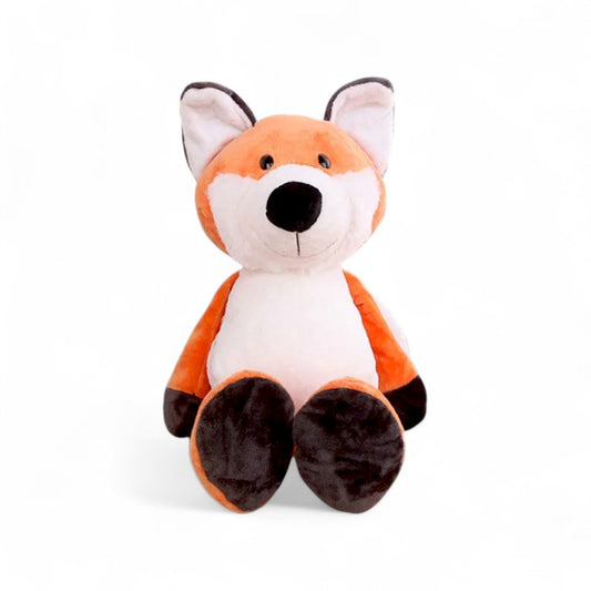 Peluche renard orange et blanc, oreilles dressées, pattes foncées, sourire doux, assise sur fond blanc.