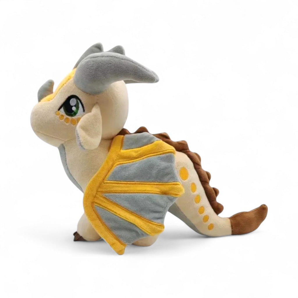 Peluche dragon féérique gris doré lumineux - vue de profil, aile repliée