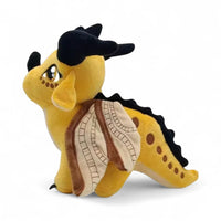 Peluche dragon féérique jaune solaire - vue de profil, aile repliée