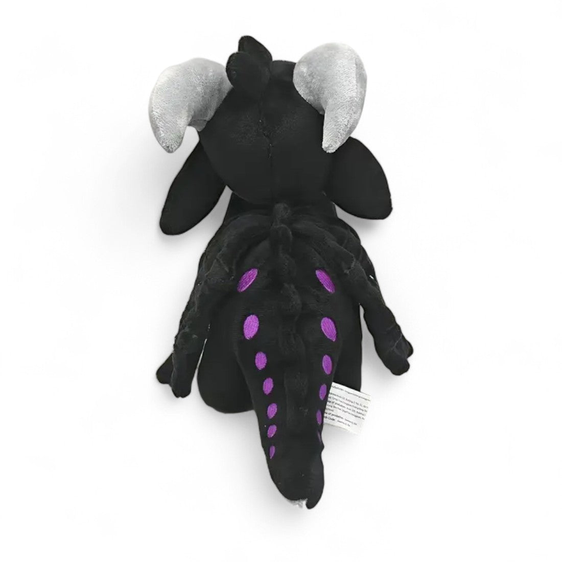 Peluche dragon féérique noir crépuscule - vue de dos, crête et queue