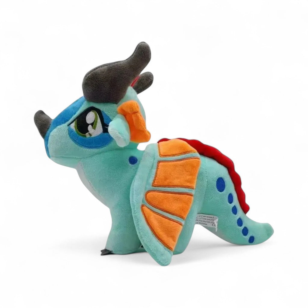Peluche dragon féérique turquoise flamboyant - vue de profil, aile repliée
