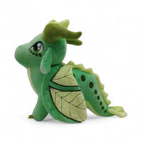 Peluche dragon féérique vert doux - vue de profil, ailes repliées