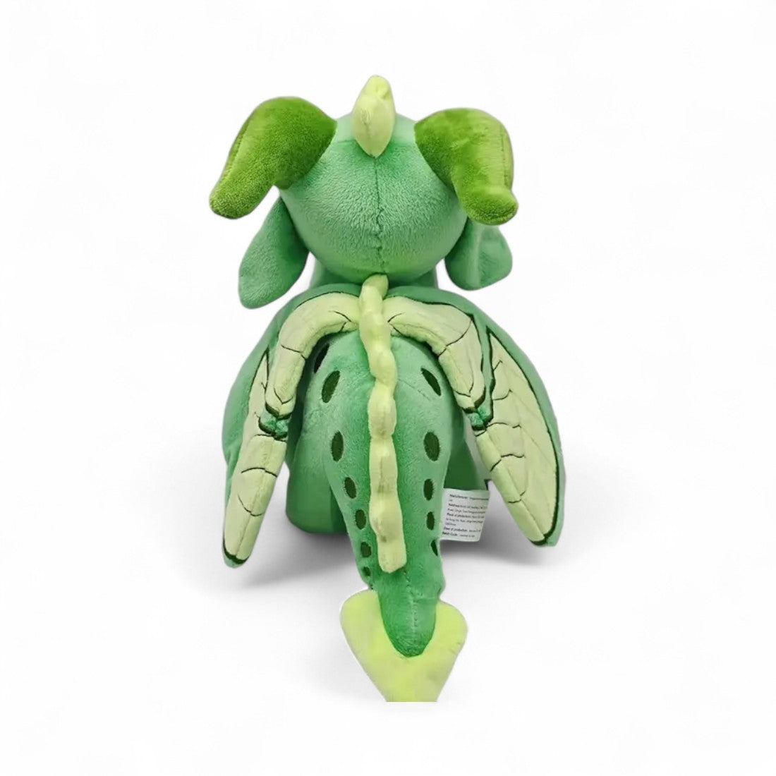 Peluche dragon féérique vert doux - vue de dos, crête et ailes