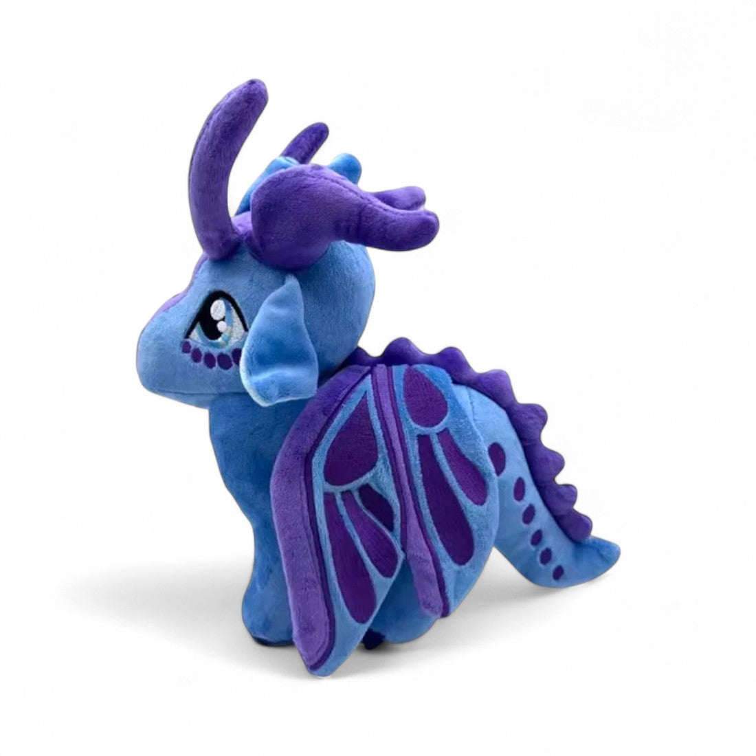 Peluche dragon féérique violet éclatant - vue de profil, aile repliée