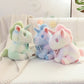 Peluche licorne pastel pour enfant avec nœud fleuri
