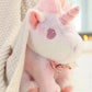 Peluche licorne pastel pour enfant avec nœud fleuri