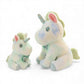 Peluche licorne pastel pour enfant avec nœud fleuri