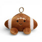 Peluche kawaii en forme de ballon de football américain de 12 cm, cuir marron texturé avec bandes et coutures blanches, grands yeux noirs brillants, sourire joyeux, joues roses, deux pattes marron potelées en bas, anneau doré attaché sur le dessus, sur fond blanc.