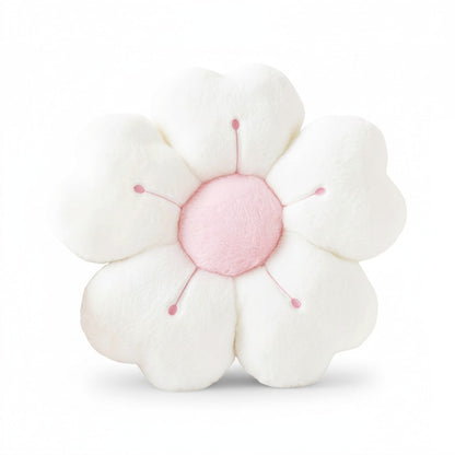 Peluche coussin en forme de fleur duveteuse blanche avec cœur rose, pétales moelleux et centre rond, posé sur fond blanc uni.