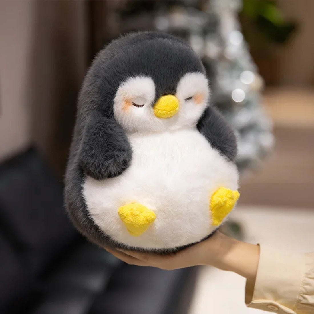 Peluche pingouin moelleux endormi