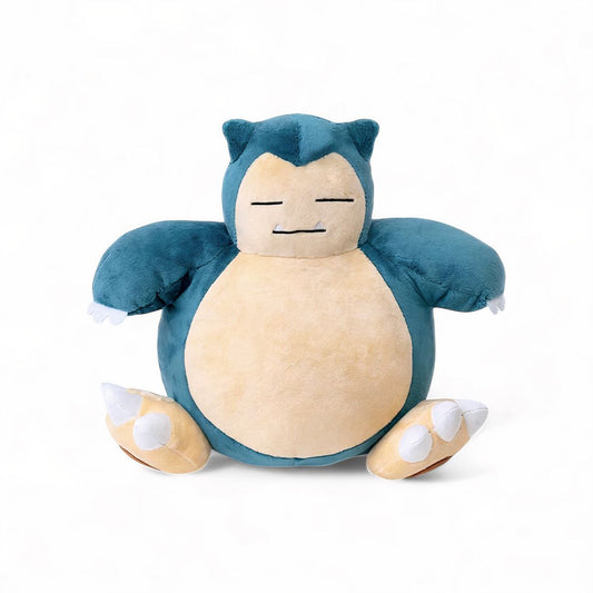 Peluche Ronflex Pokémon assis, ventre rond beige et corps bleu-vert, sur fond blanc