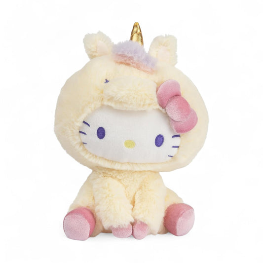 Peluche licorne jaune pastel avec corne dorée, nœud rose, oreilles en peluche, vue de face sur fond blanc.