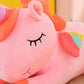 Licorne en peluche couchée pour enfant