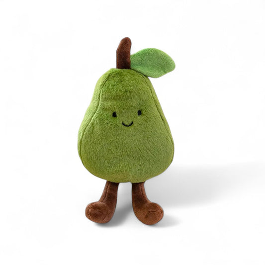 Une peluche verte en forme de poire avec un petit sourire, des pattes marron et une feuille sur la tête, posée sur fond blanc.